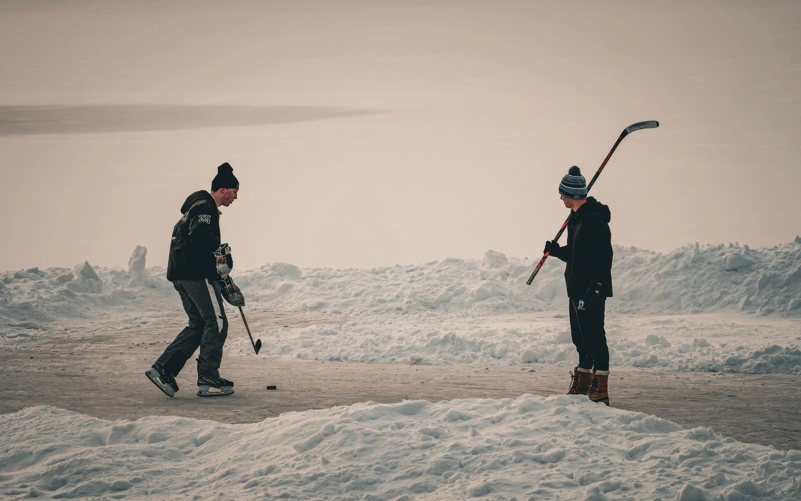Outdoor hockey rink at dusk in Canada